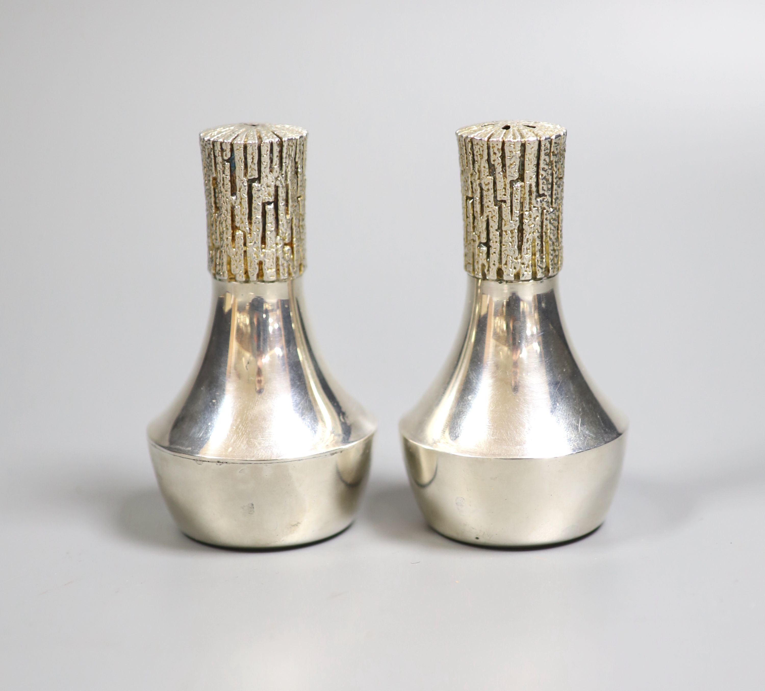 A modern pair of part textured silver condiments by Christopher Nigel Lawrence, London, 1982, 93mm, gross 141 grams.